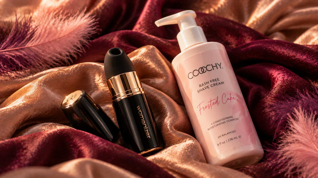 The Monthly Tickle October 2026: Womanizer Beauty and COOCHY shave cream on blush pink silk with feathers