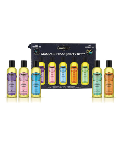 Massage Tranquility Kit with various TSA-approved massage oil bottles in a travel case in front of a black box packaging on a white background