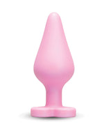 Pink silicone butt plug on a white background