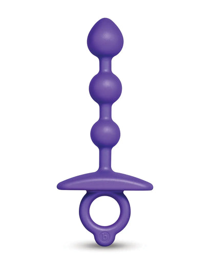 Purple anal beads on a white background