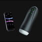 Honey Play Box Kai Pro masturbator in black with its sleeve opening visible, shown beside a smartphone running the control app