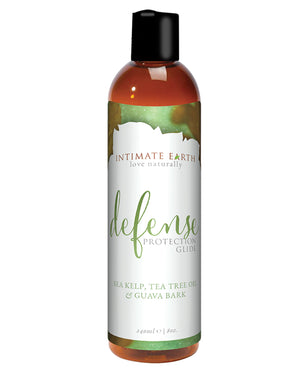 Bottle of Intimate Earth Defense Protection Glide and personal lubricant on a white background
