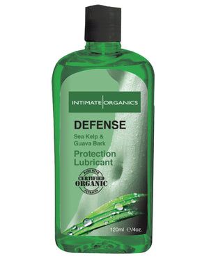 Green bottle of Intimate Organics Defense personal lubricant on a white background