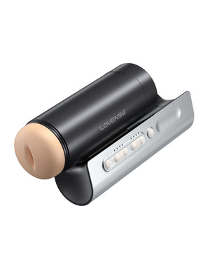 Black and silver electronic device, Lovense Solace Pro Thrusting Masturbator with beige component on a white background