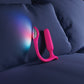 Pink and silver anal plug device on a blue pillow