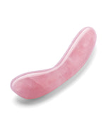 Pink g-spot sex toy on a white background