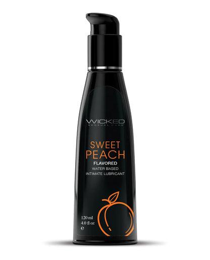 Black bottle of Wicked Sweet Peach flavored personal lubricant on a white background