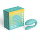 Turquoise 'Sync Lite' vibrator product and packaging on a white background