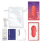 We-Vibe Touch X in Red full kit flat-lay: device, retail box, USB cable, satin storage pouch, lube sample, and instruction cards