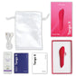 We-Vibe Tango X in Cherry Red full kit flat-lay: device, retail box, USB cable, satin storage pouch, lube sample, and instruction cards