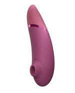 Womanizer Next Clitoral & G-spot Vibrator in Plum, side view showing the air-pulse stimulator head opening